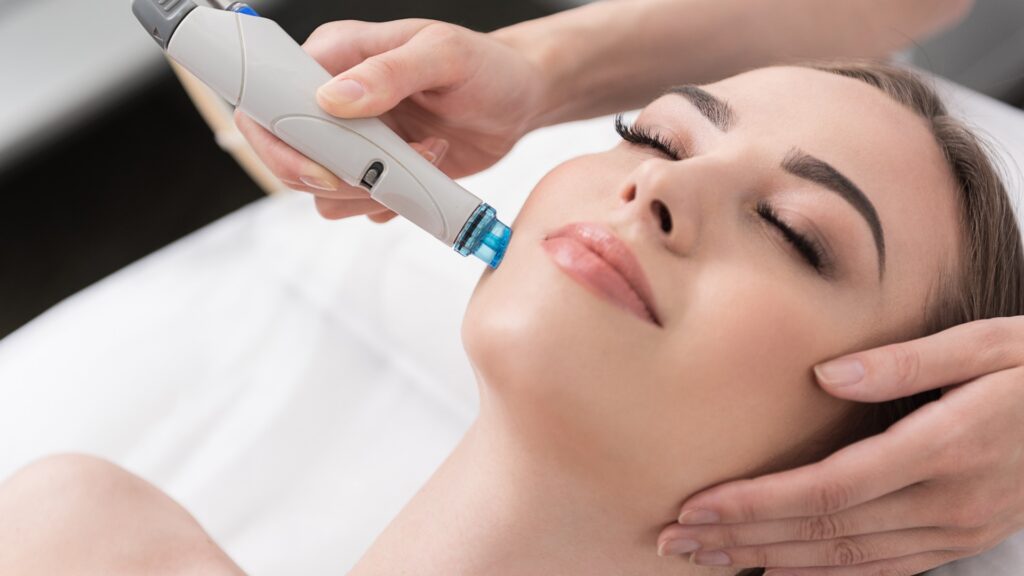 Gorgeous girl is receiving anti-aging care in spa